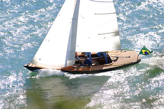 Classic 8m wooden day sailer under sail, seen from above