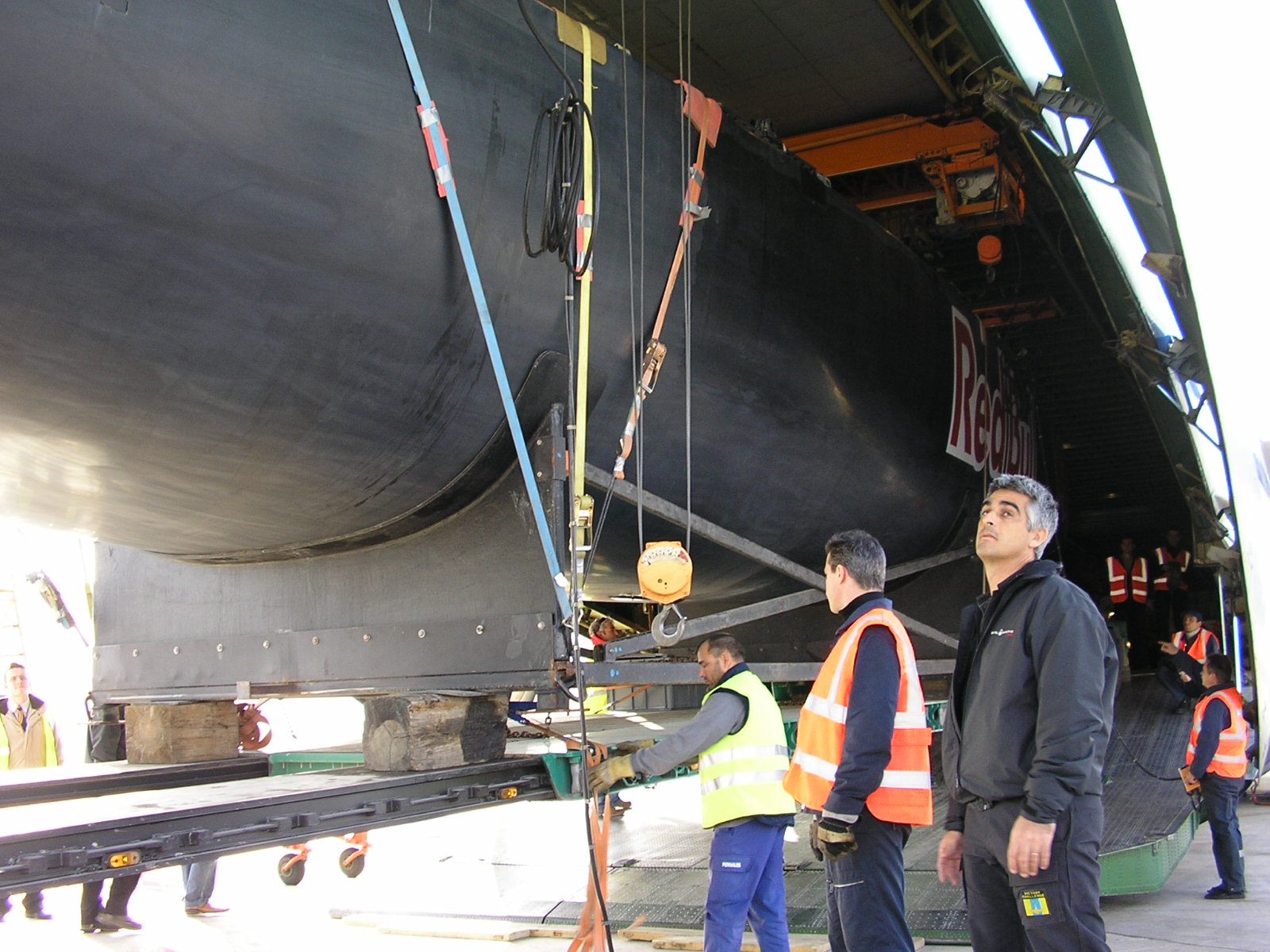 Victory Challenge mast being unloaded from an Antonov cargo aircraft