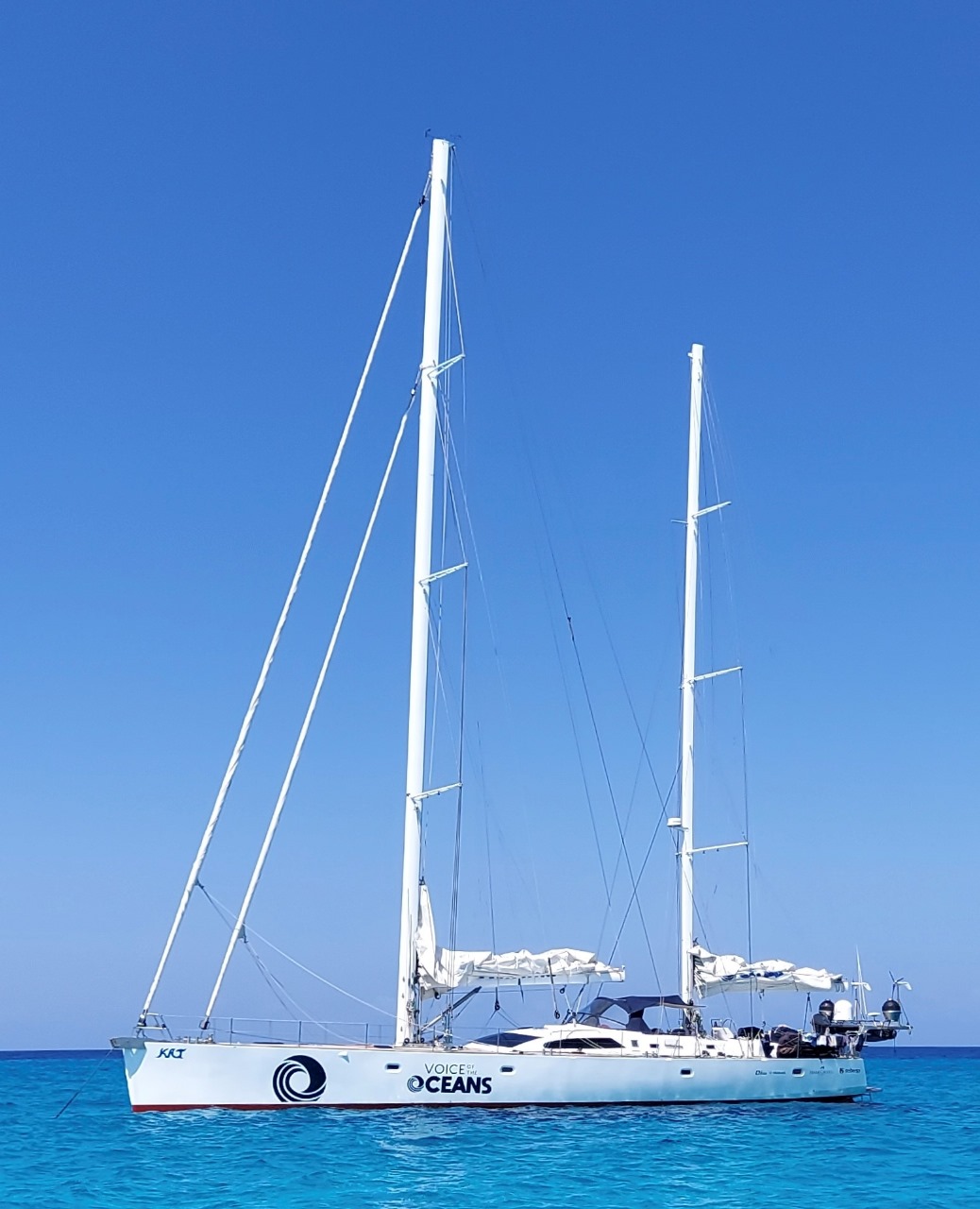 The Schurmann family’s sailing yacht Kat at anchor in clear blue water